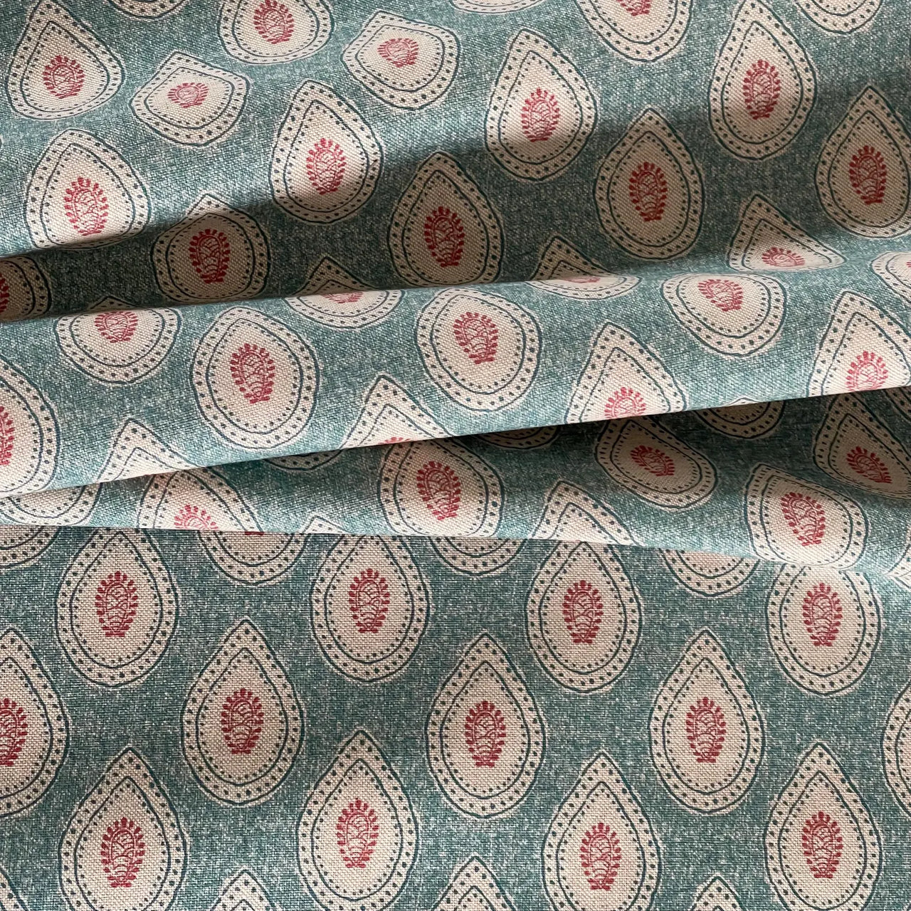 Linen texture fabric with teal paisley pattern for interiors