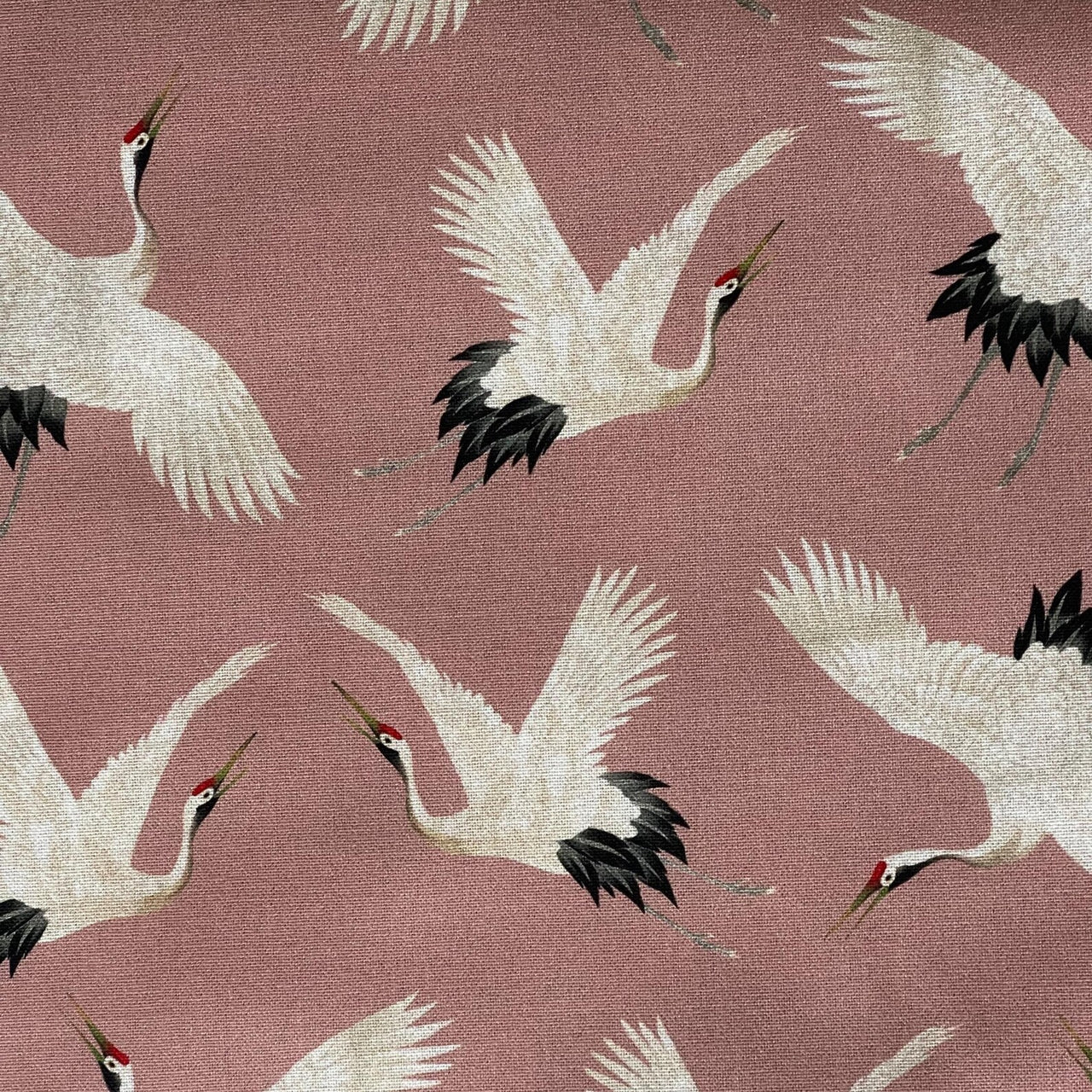Smooth cotton fabric with repeating Japanese crane artwork.