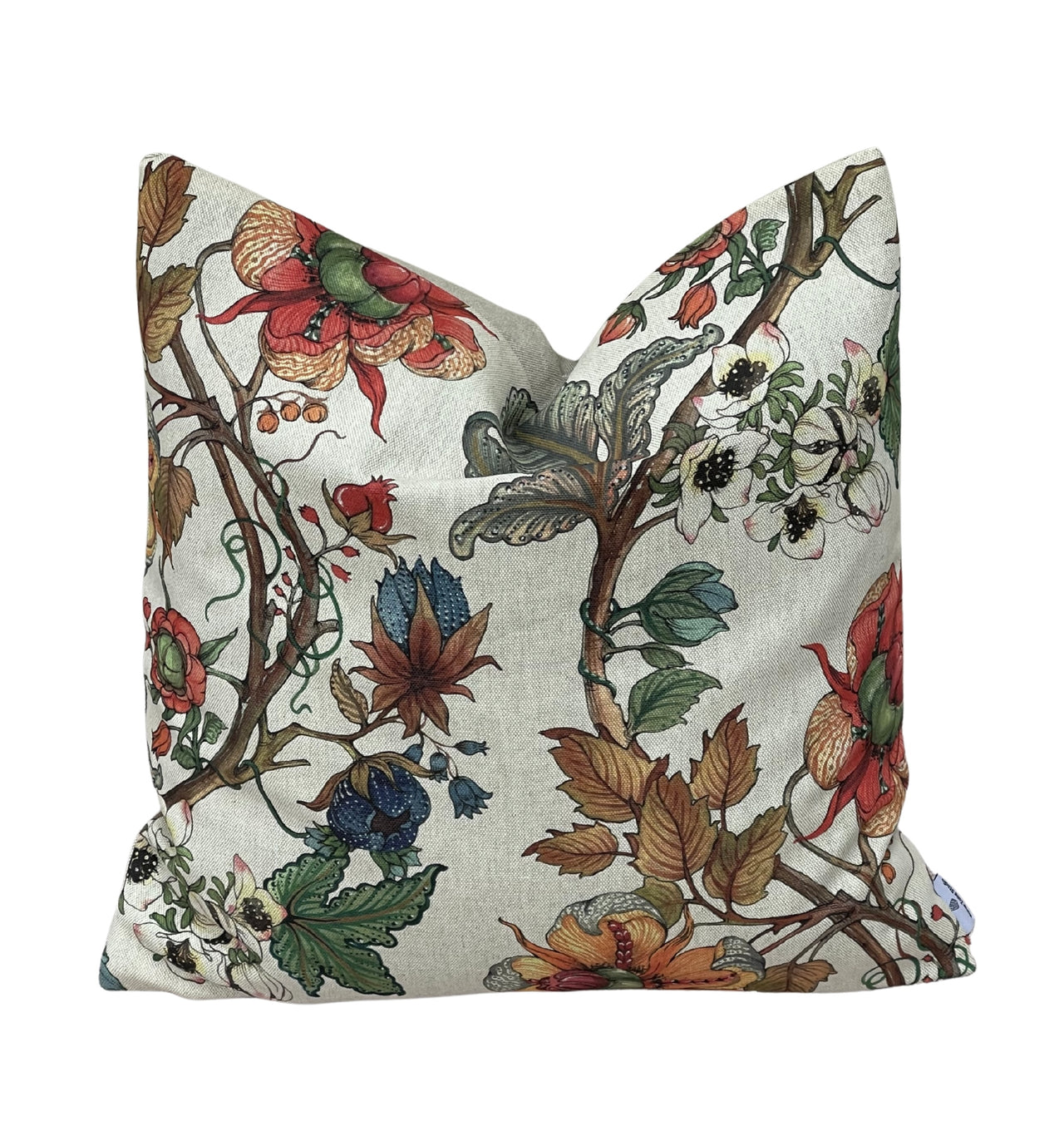 Heritage floral cushion cover in muted red, green, blue and brown country colours.
