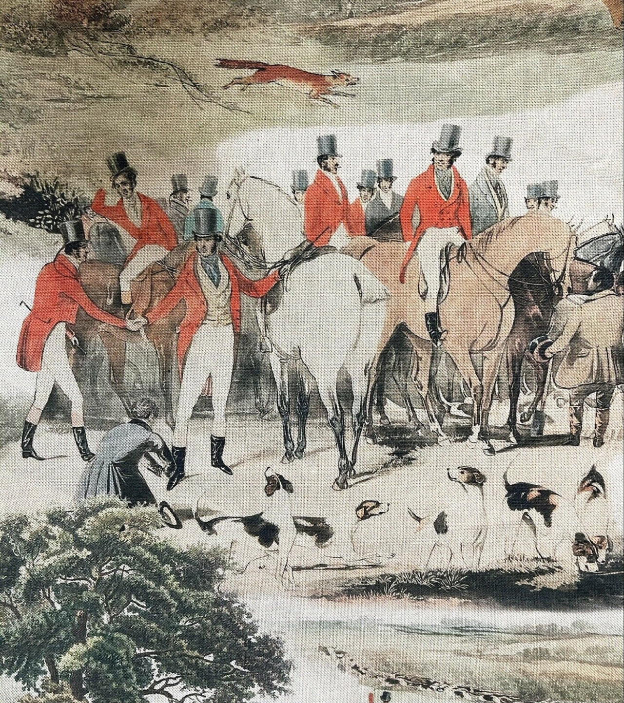 Vintage hunting scene cotton fabric with riders in red coats on horseback, accompanied by hunting dogs in a countryside landscape with green, grey, and red tones.