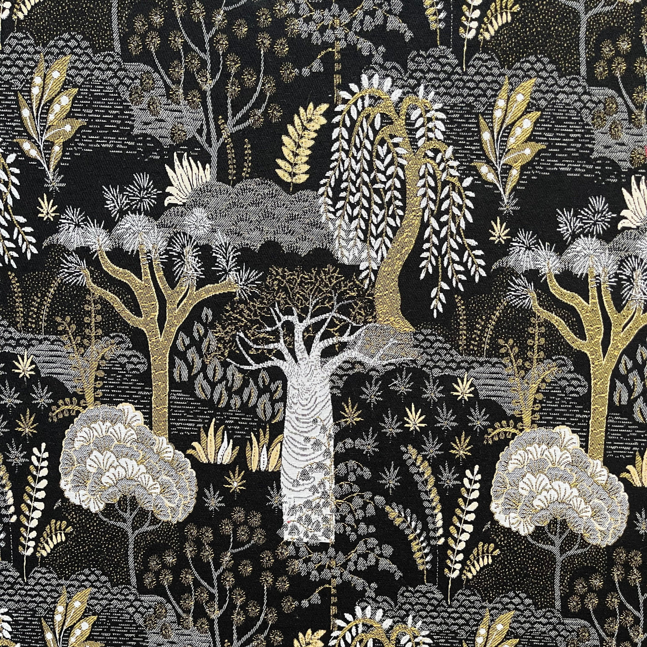 Baobab Botanical Black and Gold Upholstery Fabric close-up.