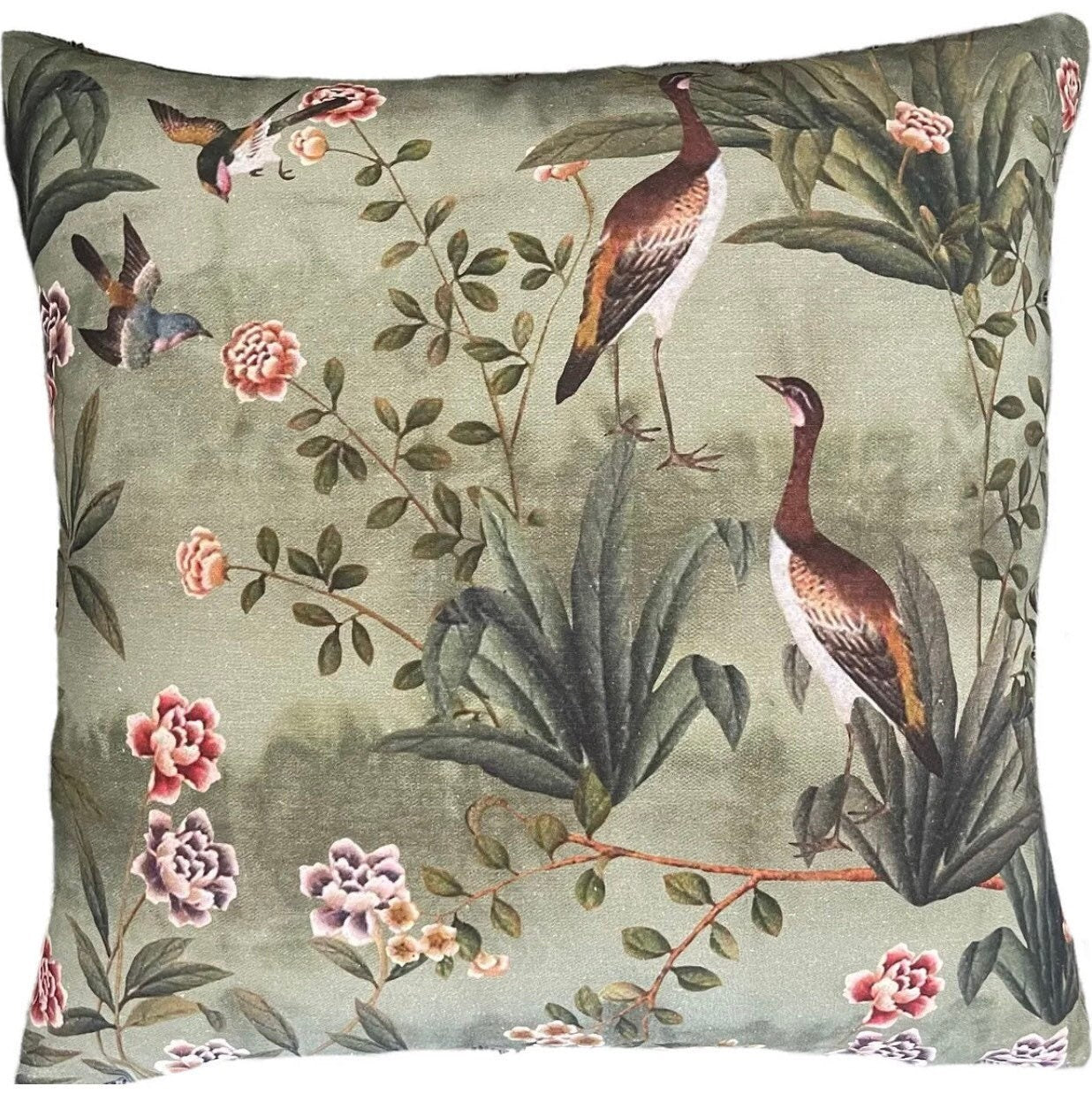 Decorative pillow with bird and floral pattern on a green background