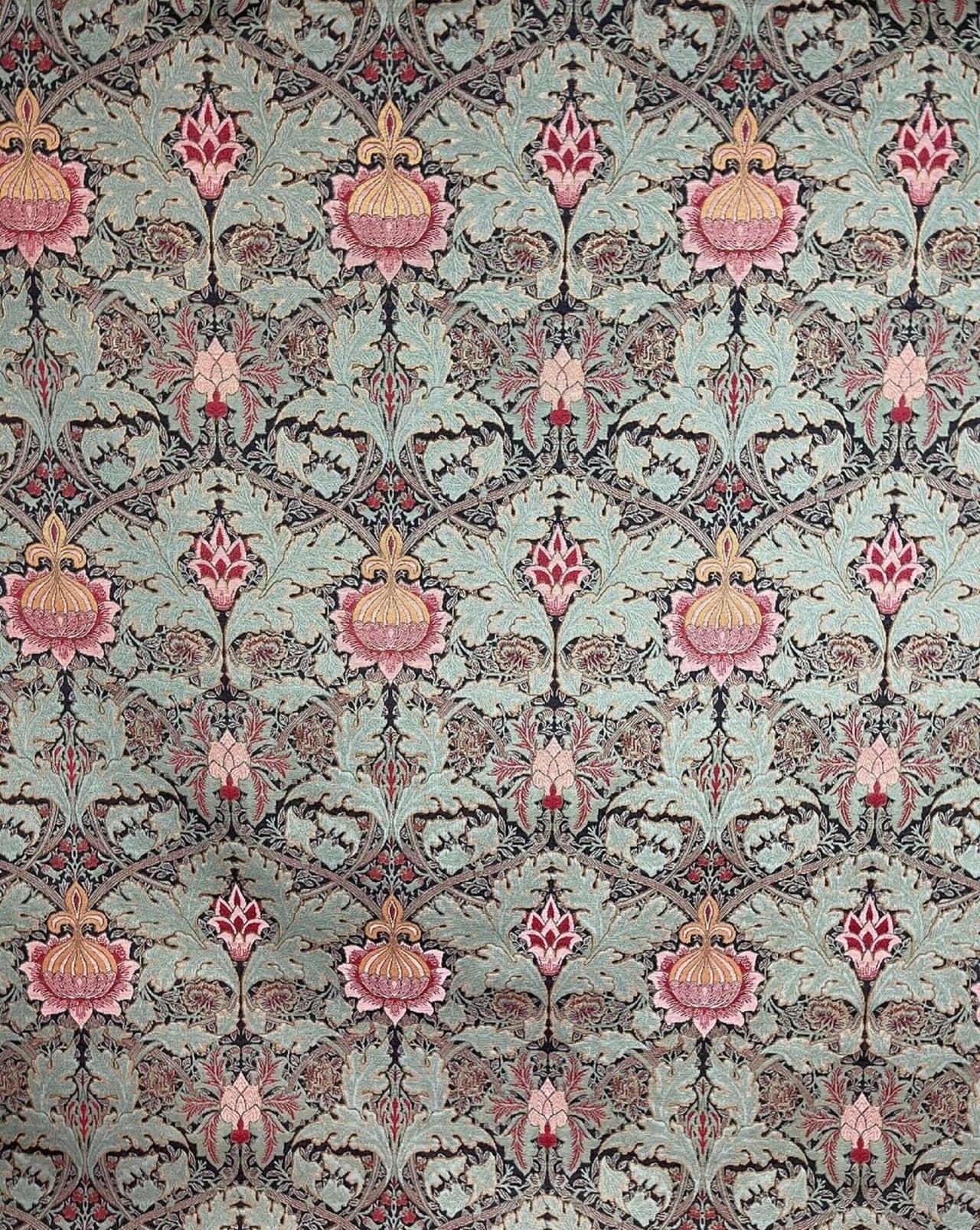 Detailed botanical pattern on heavy upholstery textile.

