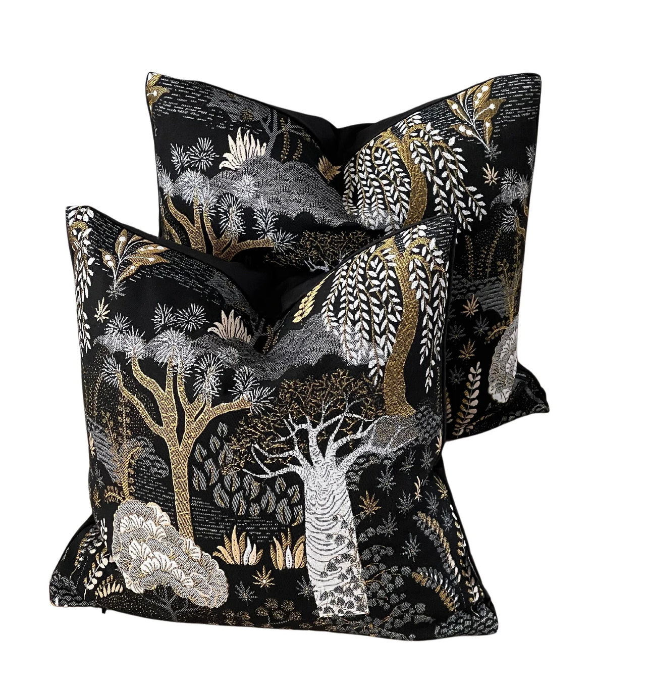 Black botanical throw pillow with shimmering gold details.