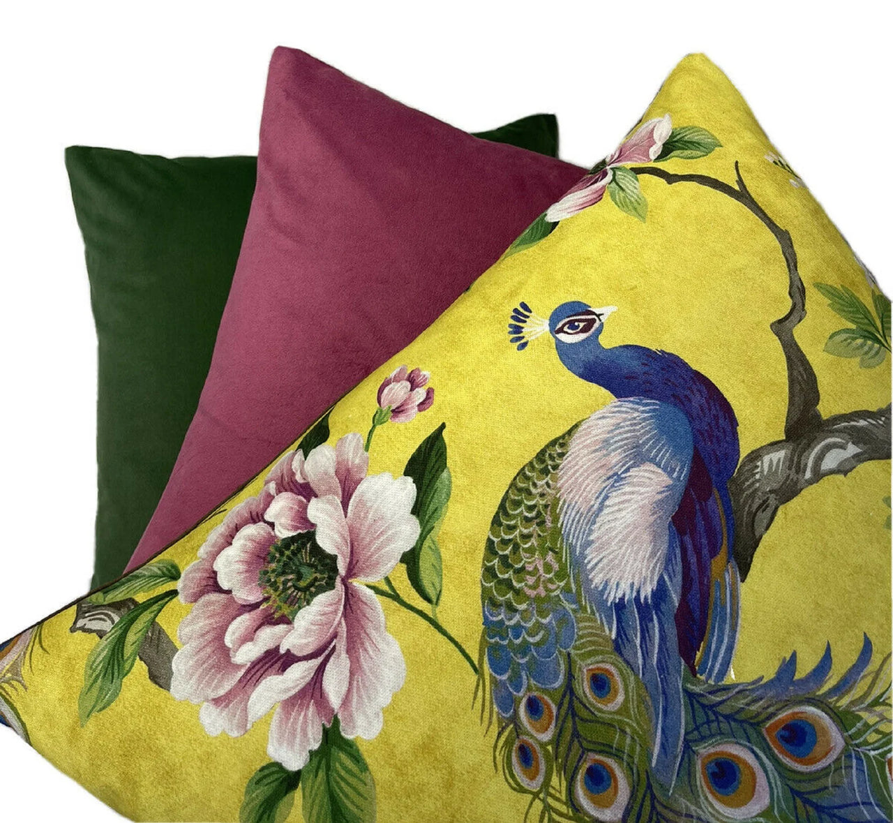 Yellow cushion featuring a blue peacock and flowers.
