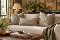 Thumbnail for Three beige floral medallion cushions, two square and one rectangular, styled on a cream sofa in a country cottage living room.