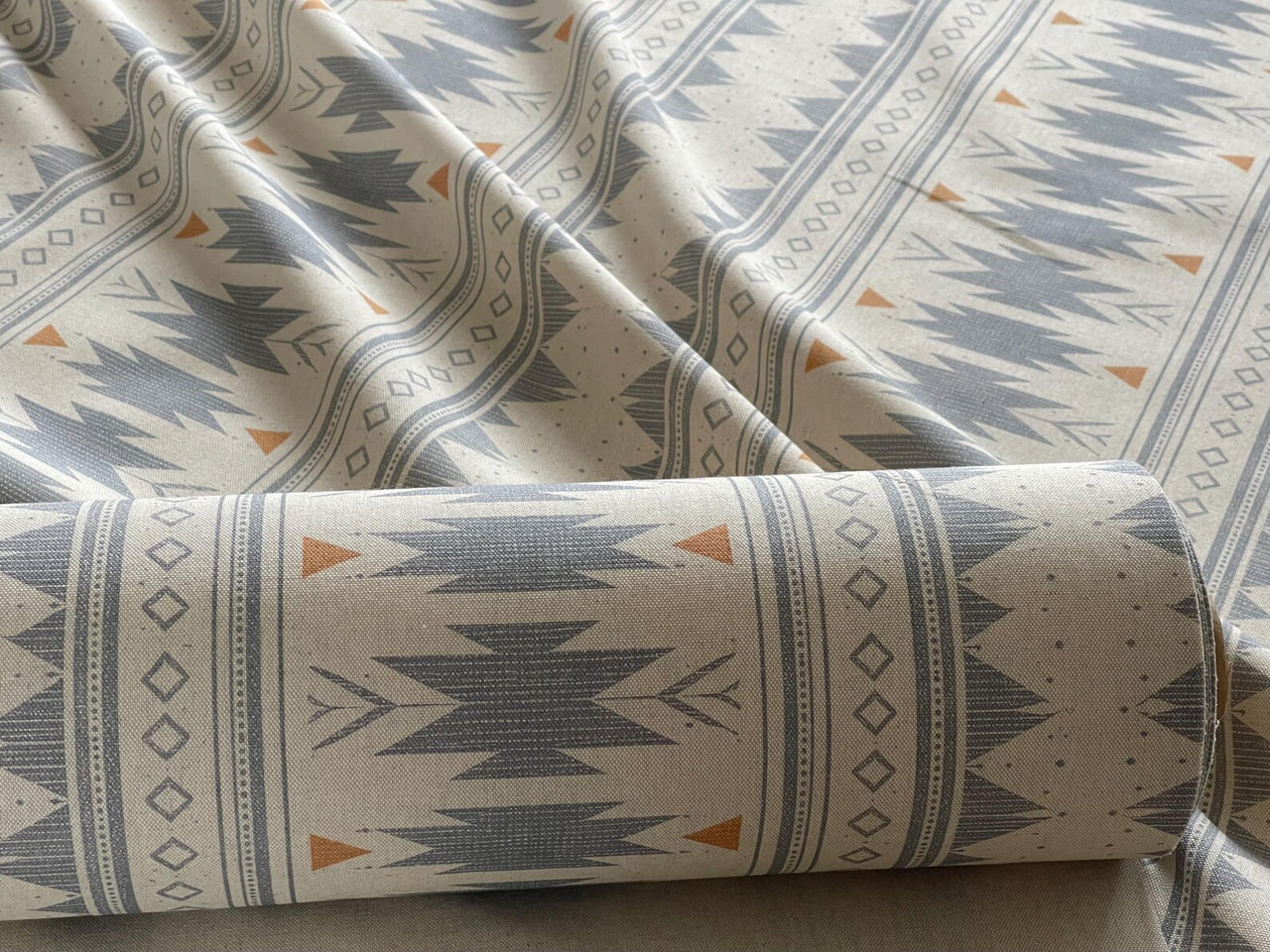 Aztec stripe fabric in blue grey tones with diamond and arrow motifs