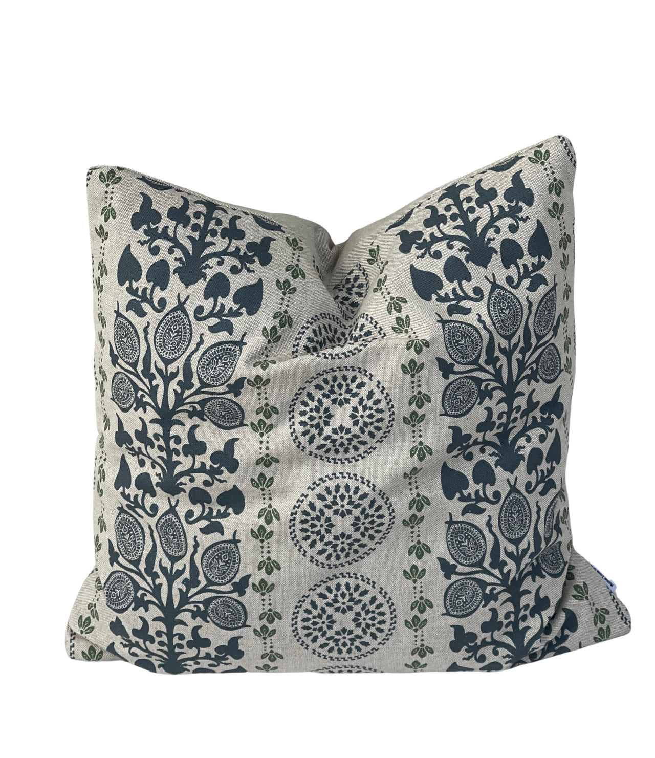 Country style blue cushion cover with medallion and botanical motifs on textured neutral fabric.