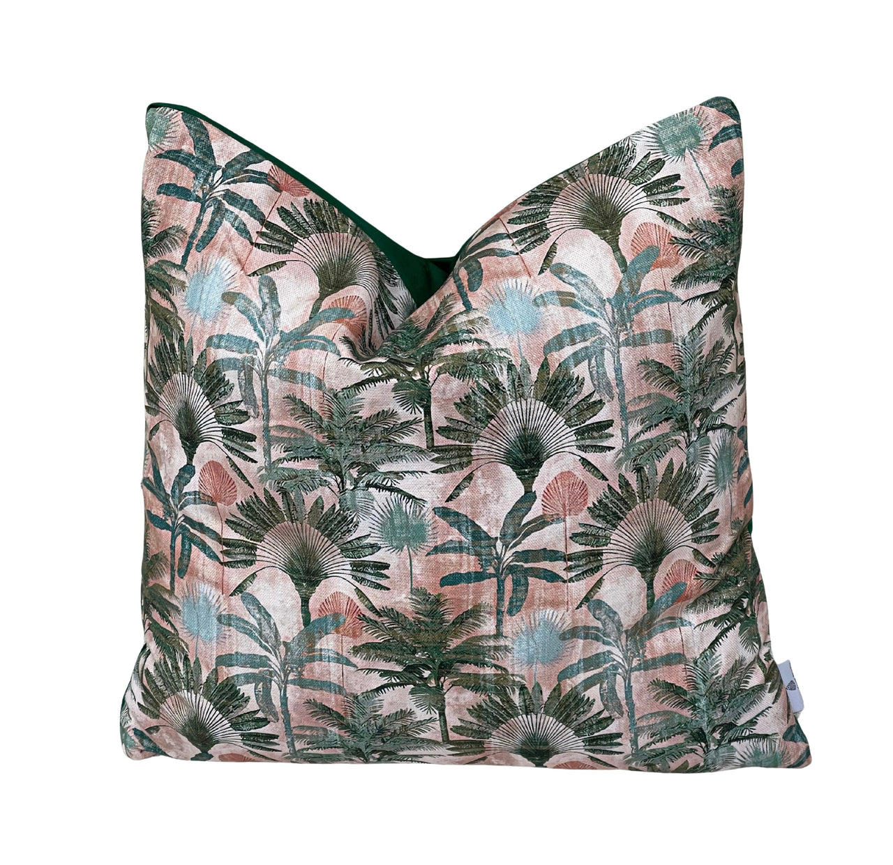 Handmade blush pink tropical palm cushion cover featuring deep green jungle foliage, fan palms and soft teal botanical leaves on cotton blend fabric