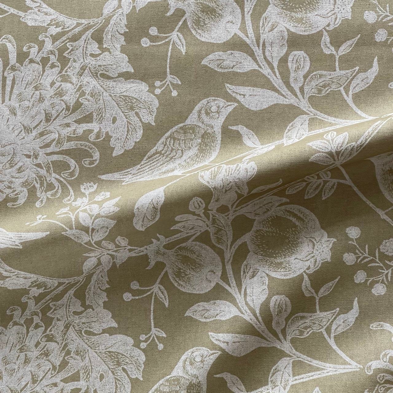 Floral bird print fabric in warm soft gold tones