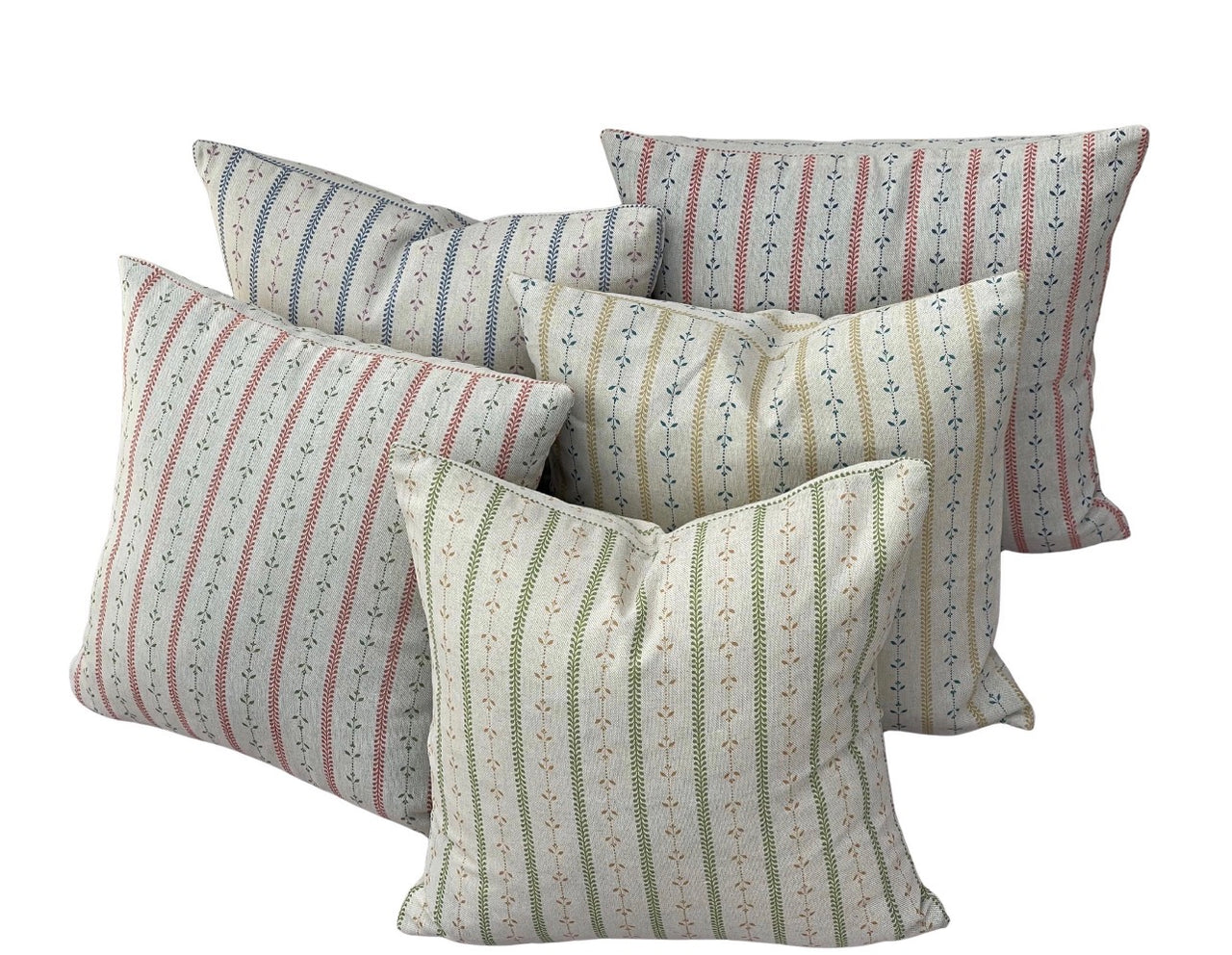 Coordinating botanical stripe cushion covers in red, blue, green and ochre on natural fabric