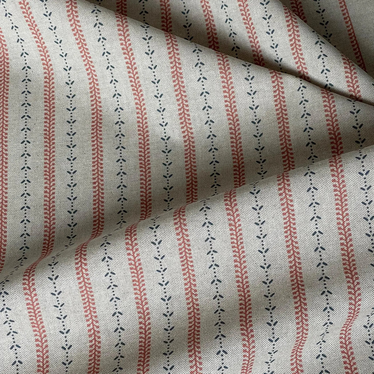 Country style stripe fabric with indigo leaf motifs and red detailing