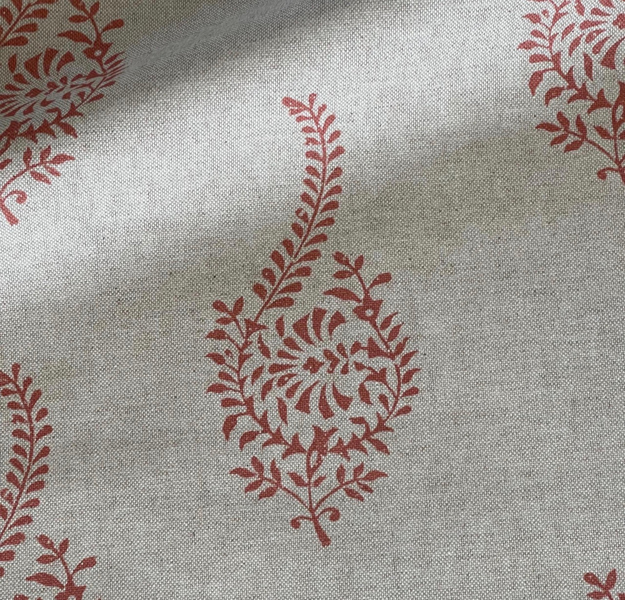 Coral buta block print fabric with Indian paisley sprigs on natural beige linen-look cloth