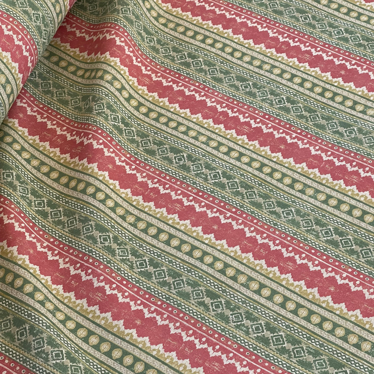 Close-up of woven cotton-linen blend with red and green pattern

