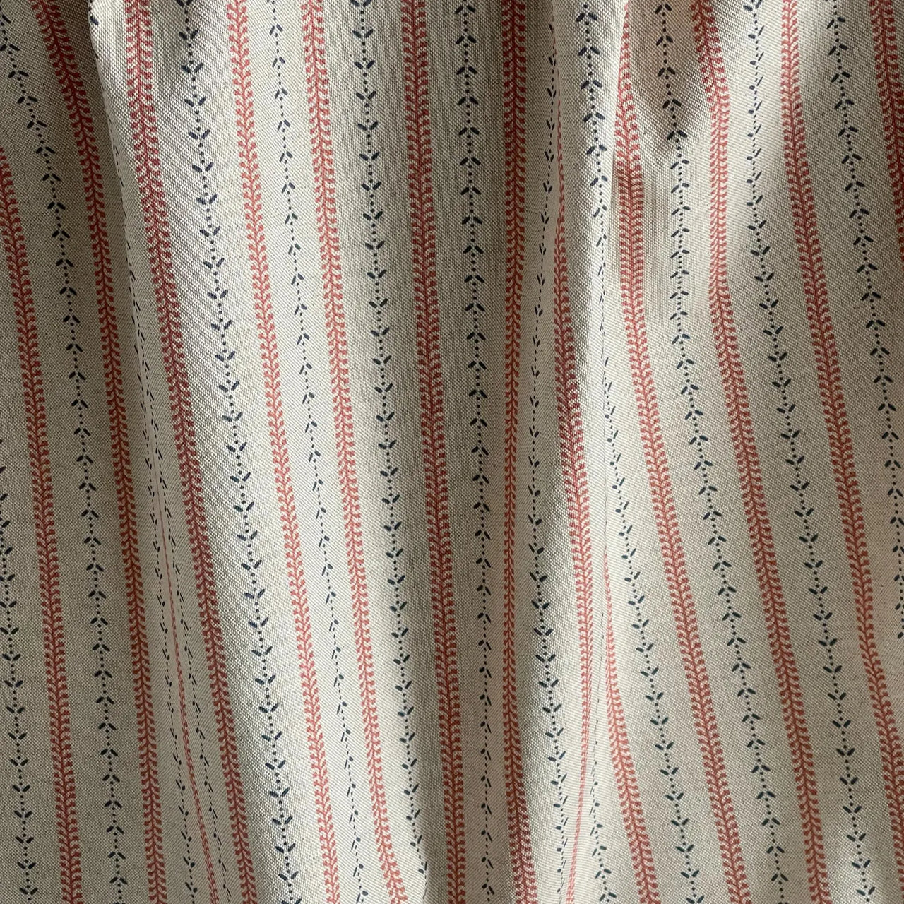 Heritage stripe fabric with indigo botanical trails and red stitching