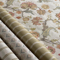 Thumbnail for Rolls of fabric with floral and stripe patterns on a neutral background