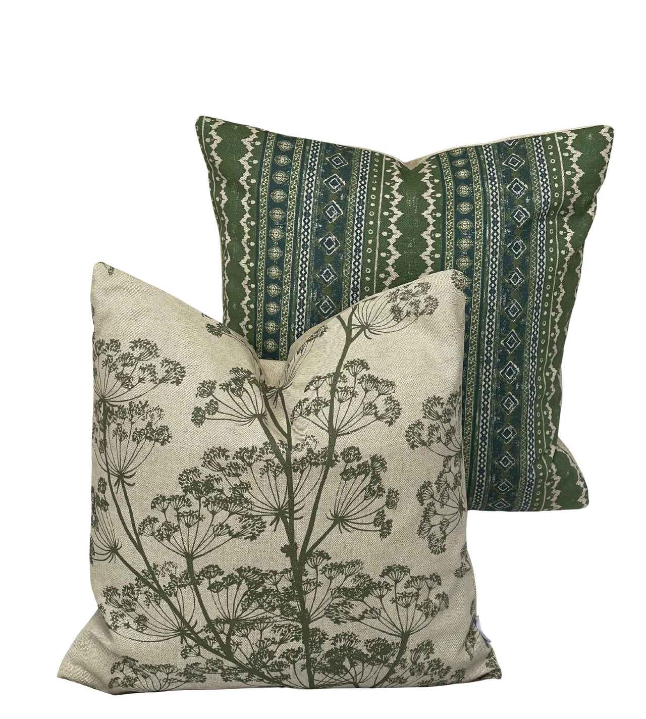Two decorative pillows, one with green pattern and the other with floral design, on a white background.