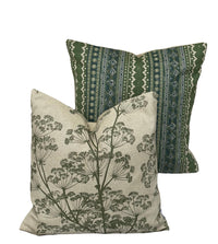 Thumbnail for Two decorative pillows, one with green pattern and the other with floral design, on a white background.
