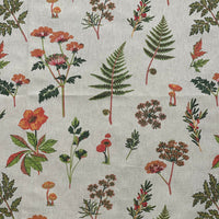 Thumbnail for Close-up of small orange woodland mushrooms on pale grey botanical fabric with delicate green foliage.