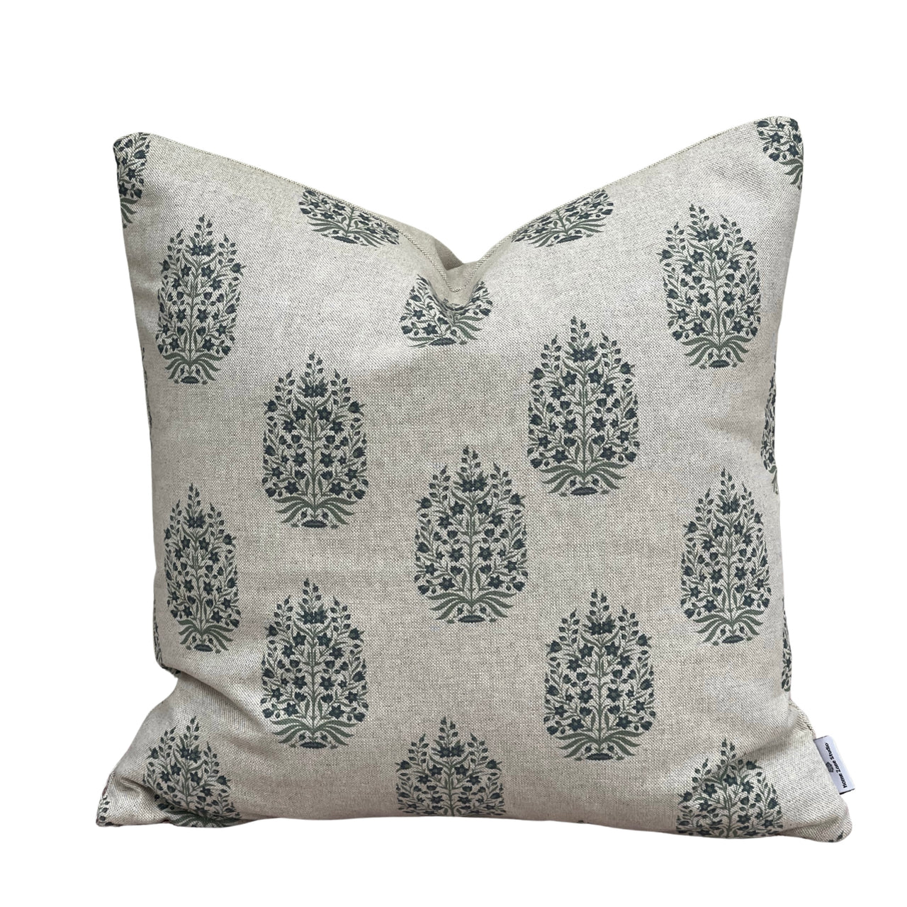 Close-up of traditional blue-grey botanical medallion print on natural linen-look cushion fabric