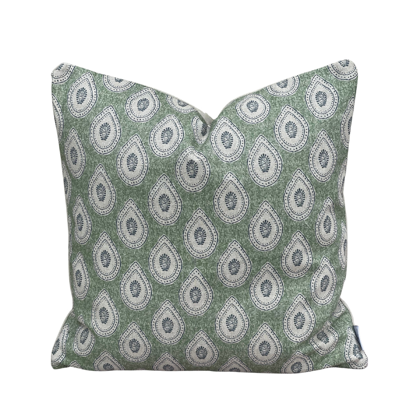 Close-up of traditional ivory paisley teardrop print on sage green linen-look cushion fabric