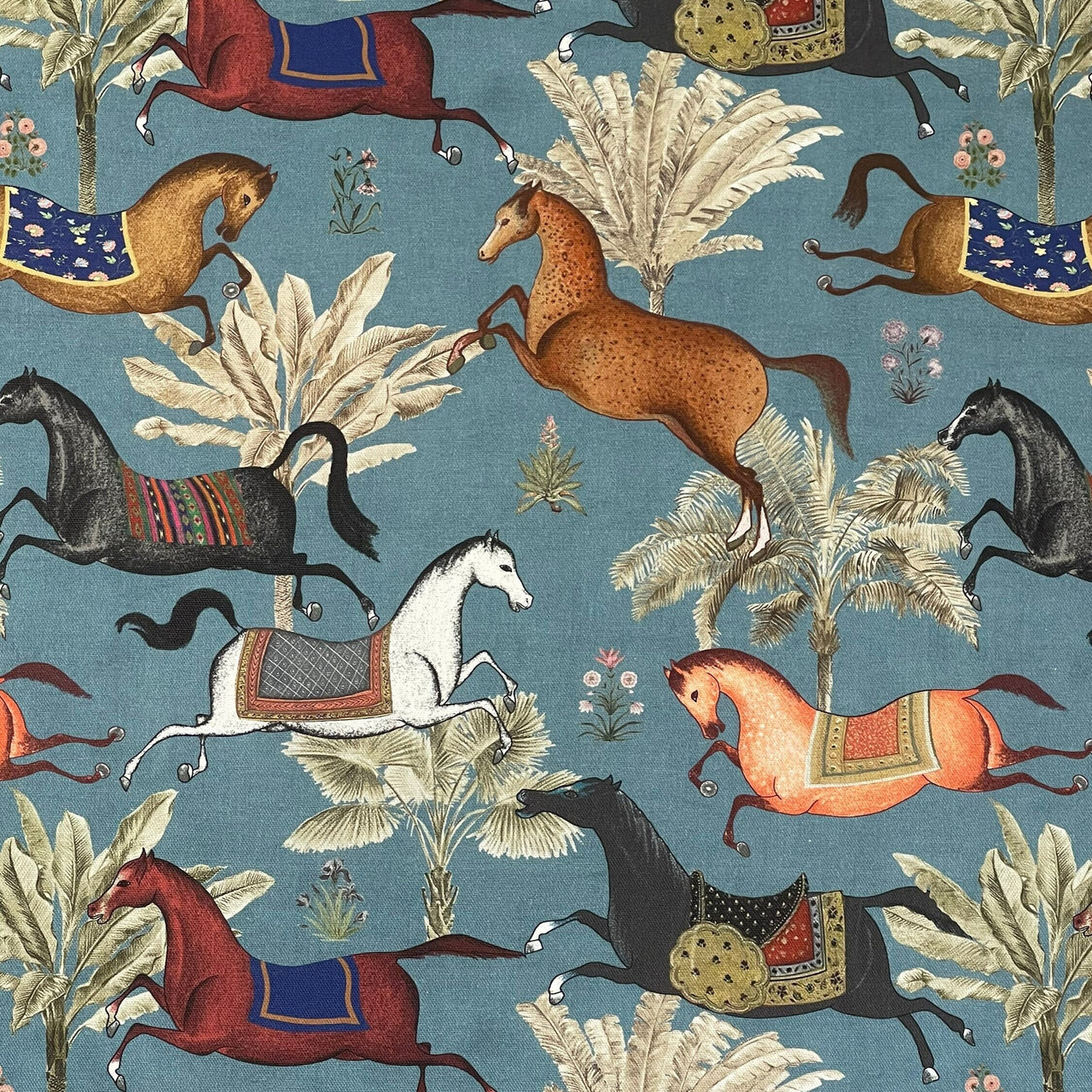 Pattern of horses and plants on a blue background