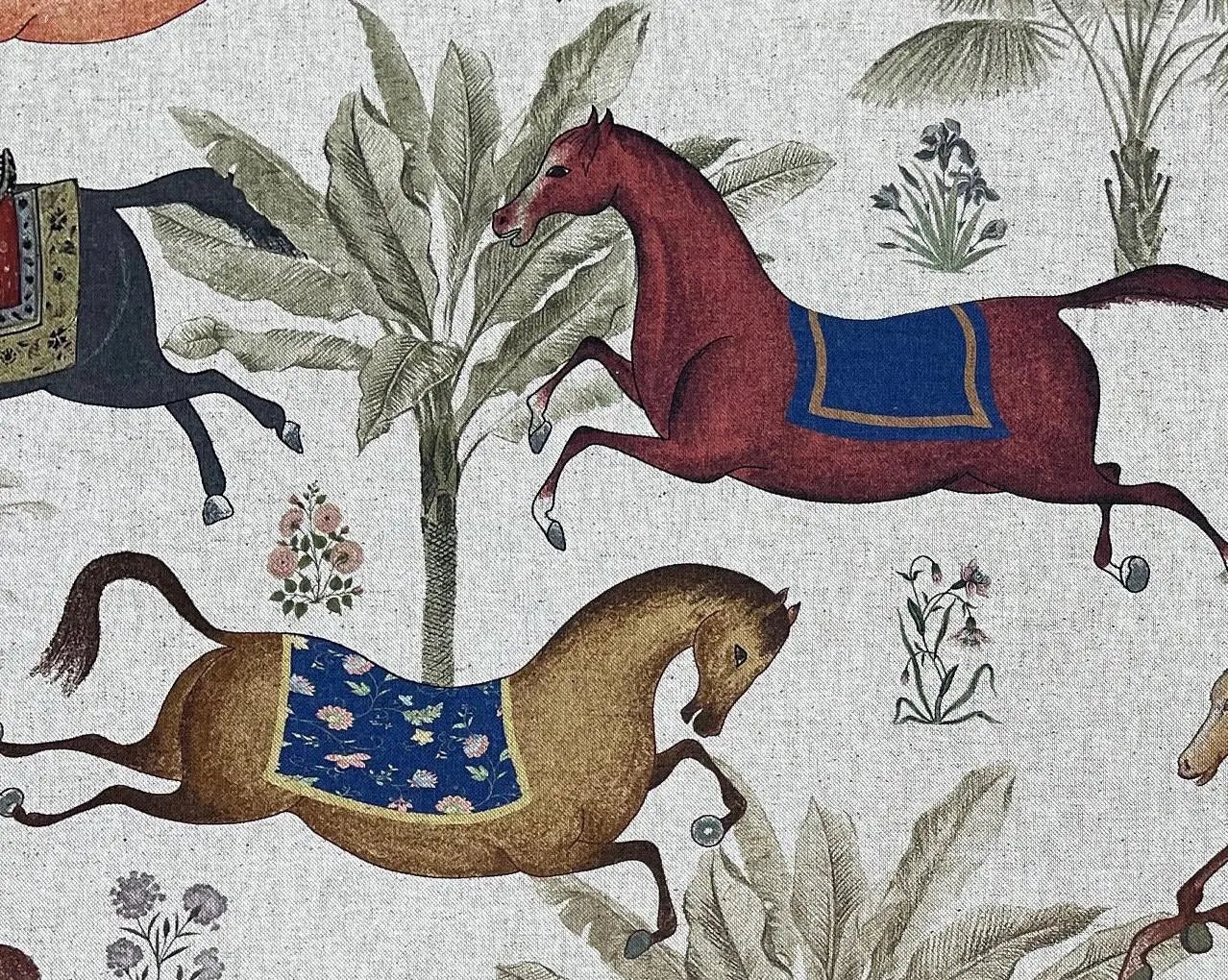 Decorative fabric with horses and plants on a textured background