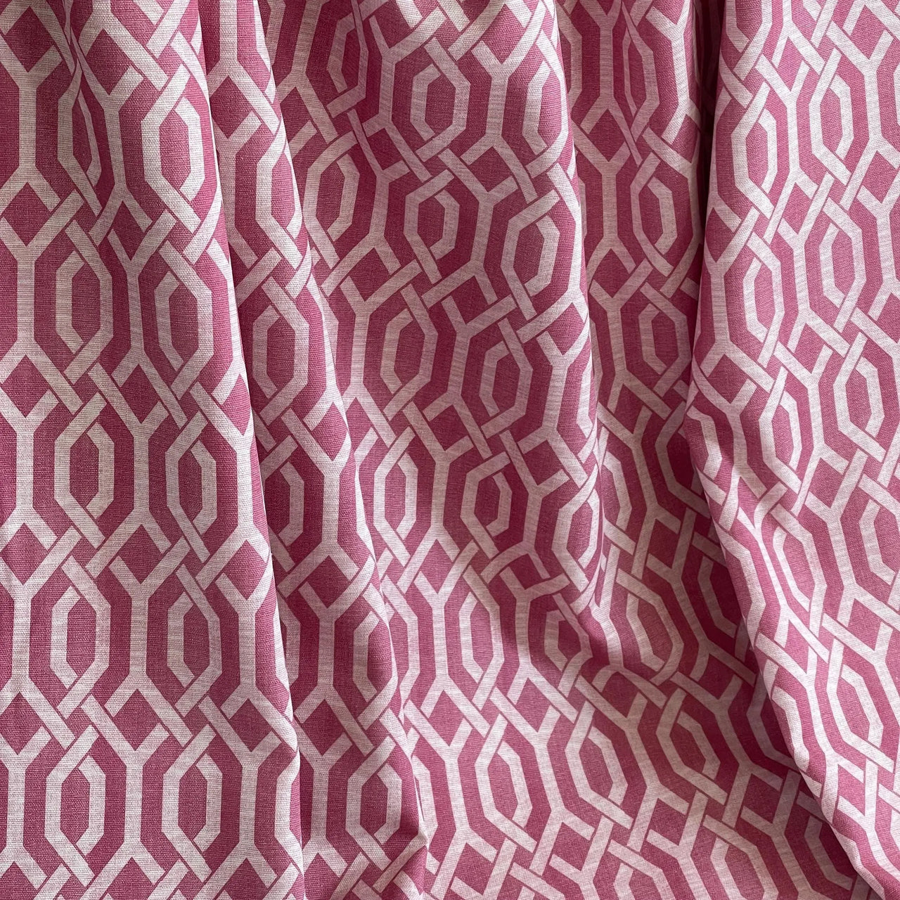Blush pink interlocking pattern cotton fabric for stylish soft furnishings – perfect for contemporary roman blinds, drapes, and upholstery crafts.