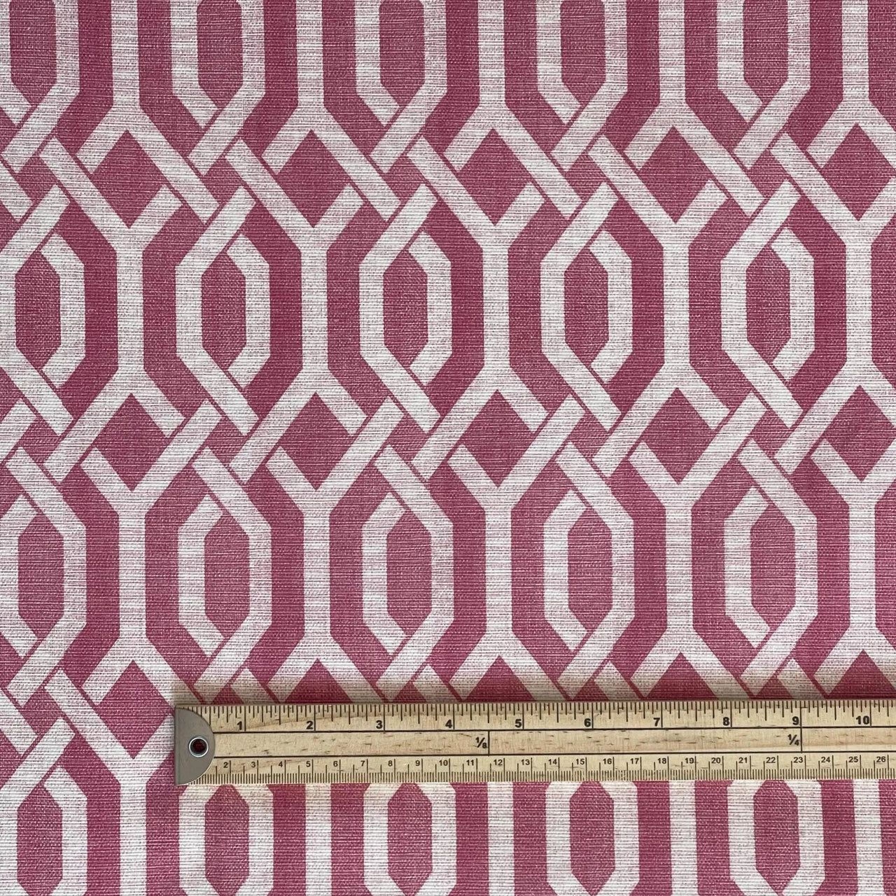 Modern mauve interlocking pattern cotton fabric with scale indicator – perfect for contemporary window treatments, blinds, and home sewing designs.
