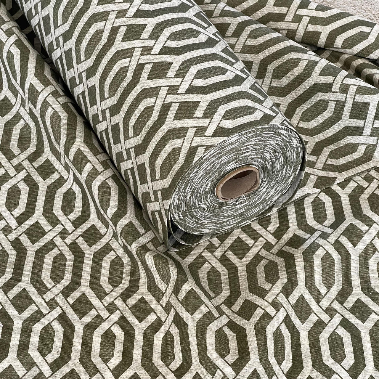 Rolled fabric in modern trellis design – soft green print for creative home decor 
