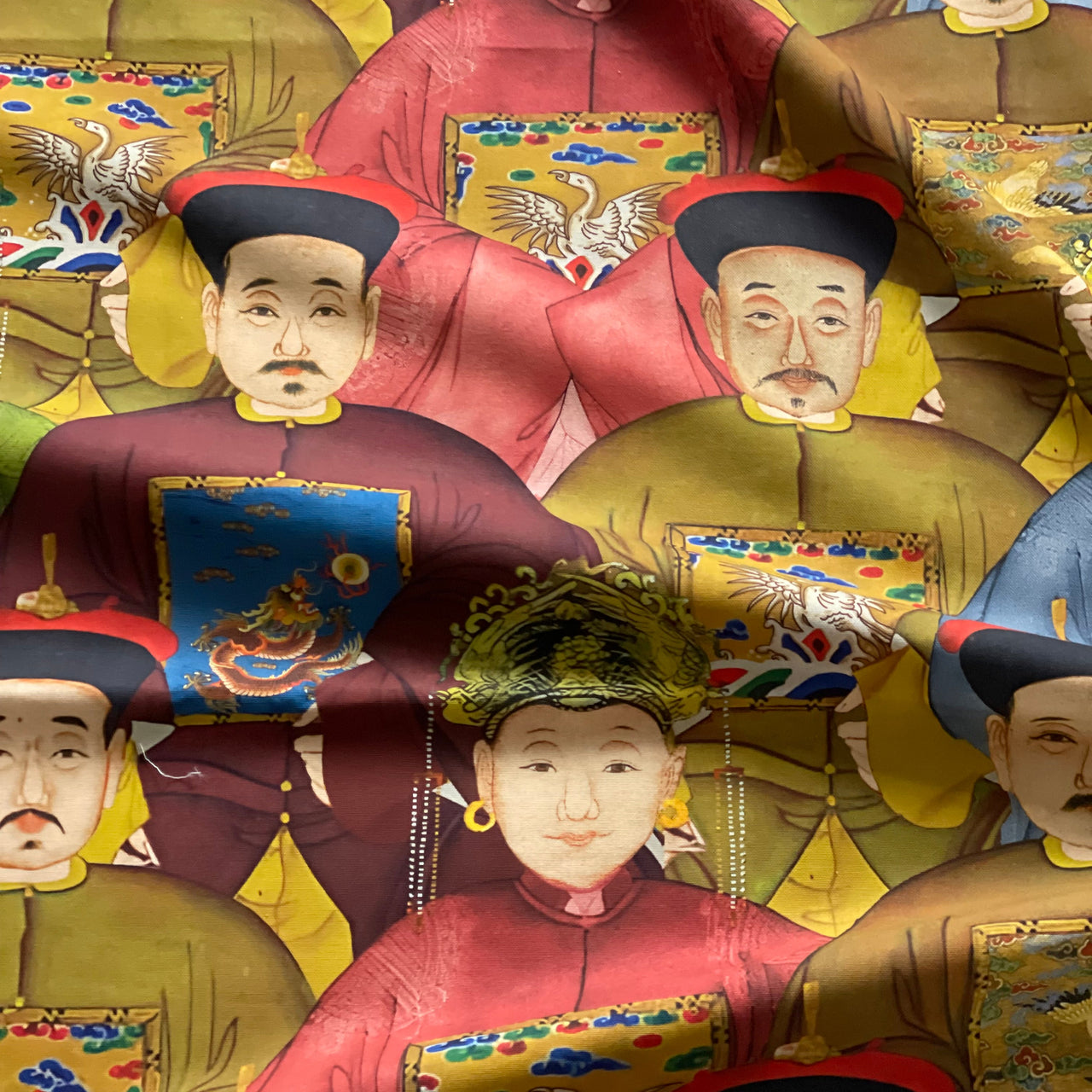 Imperial Court chinoiserie printed cotton fabric featuring colourful Chinese royal portraits in burgundy, olive green, blue and antique gold.