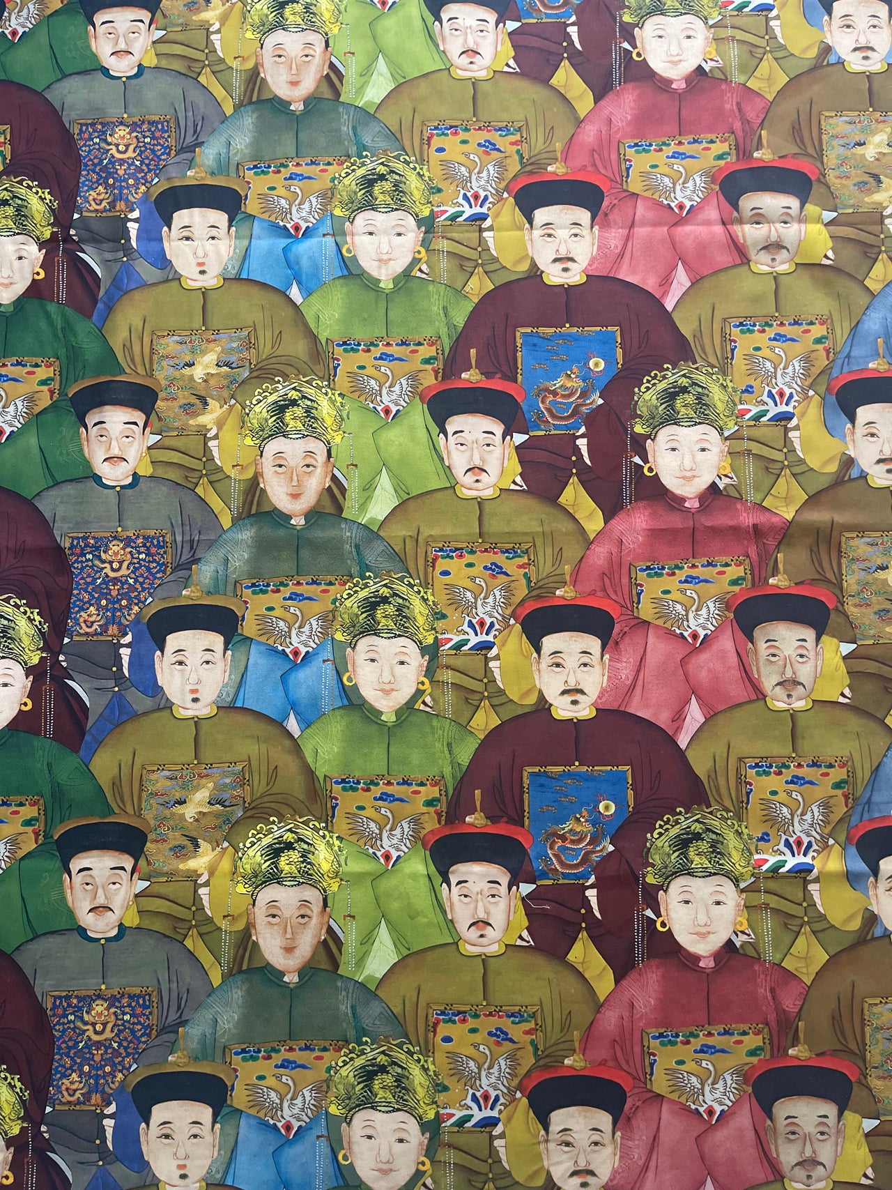 Imperial Court printed cotton drapery fabric featuring bold figurative portraits in burgundy, antique gold, olive green and blue.