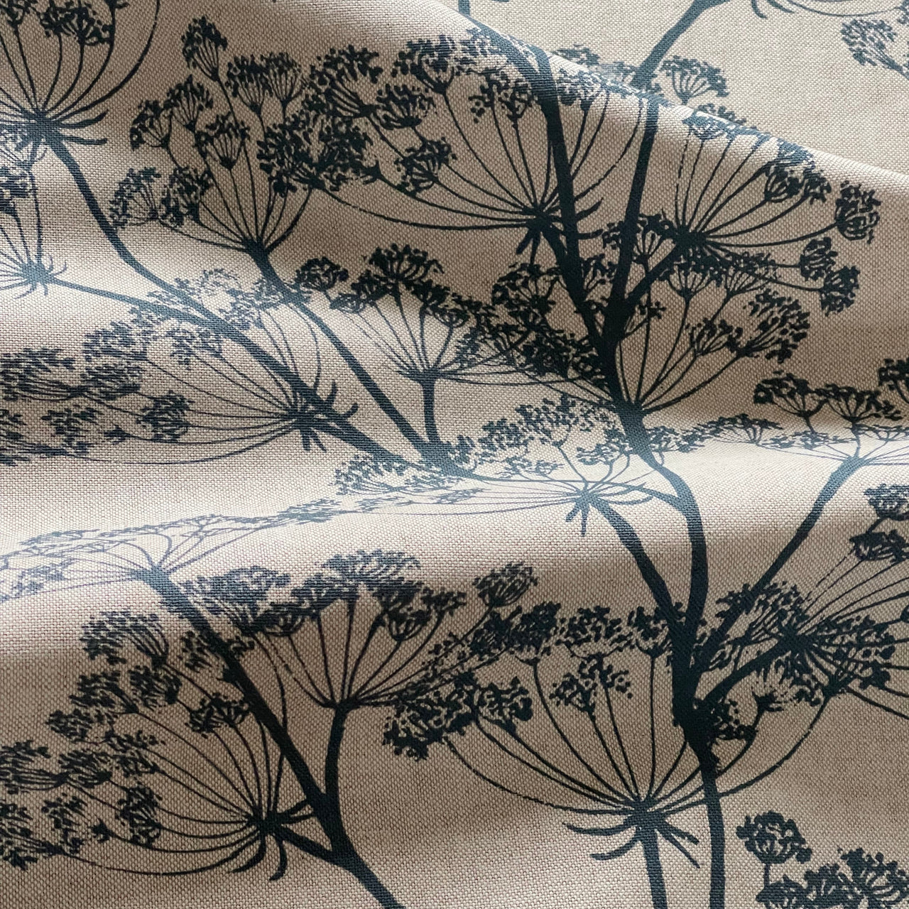 Indigo blue cow parsley fabric with botanical floral print on natural linen look background