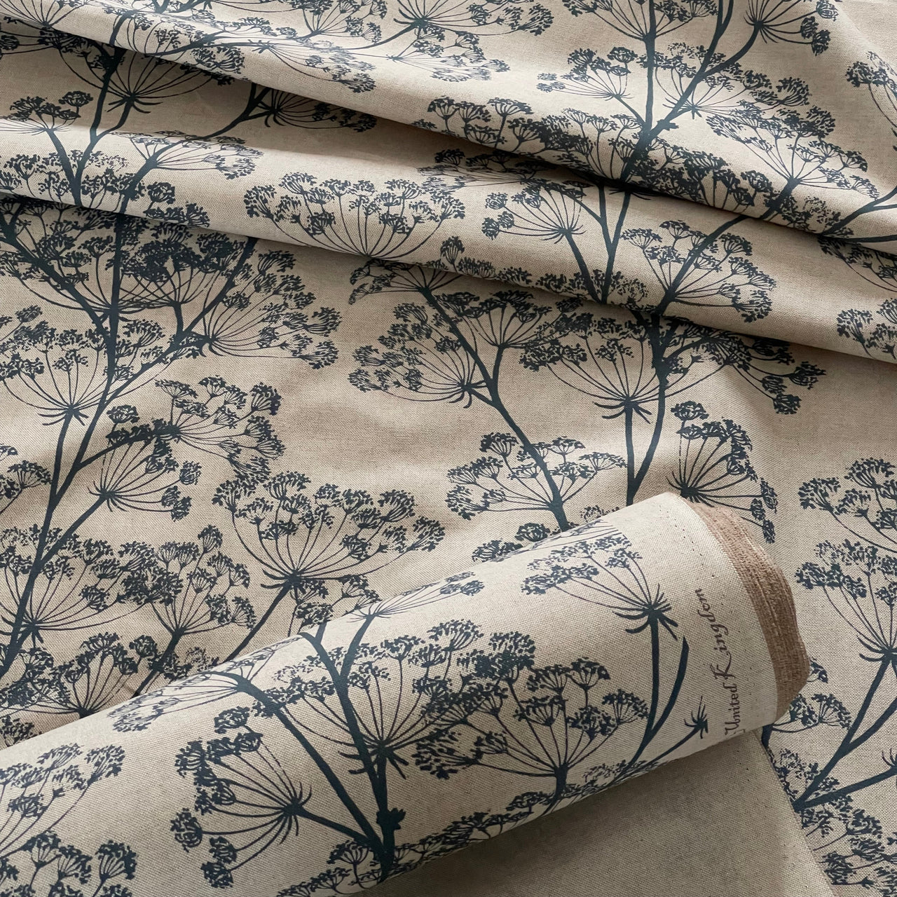 Botanical linen look fabric with soft blue wildflower silhouettes