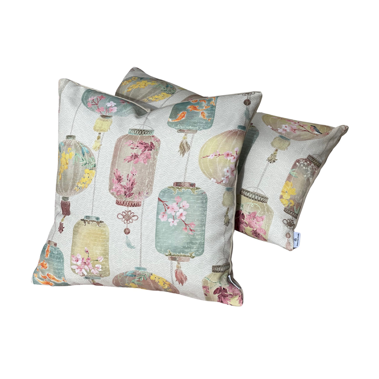Ivory linen-look Asian lantern cushion with decorative pastel green, pink and yellow lanterns featuring koi fish and cherry blossom motifs.