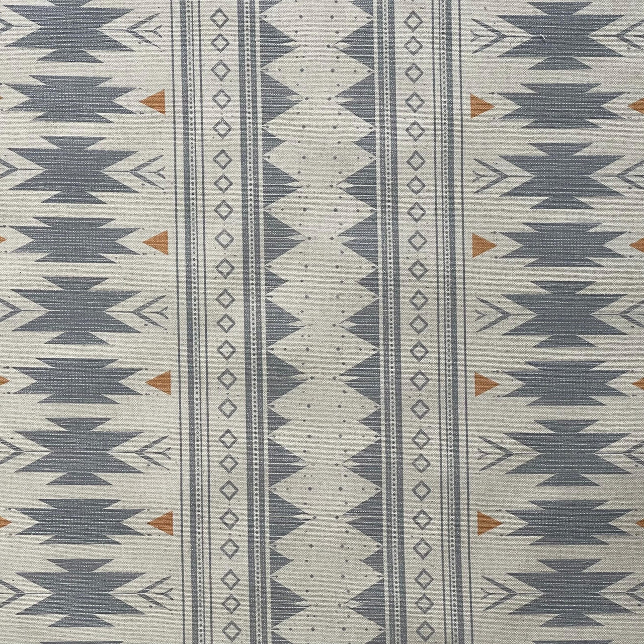 Close up of blue grey tribal geometric fabric with linen texture