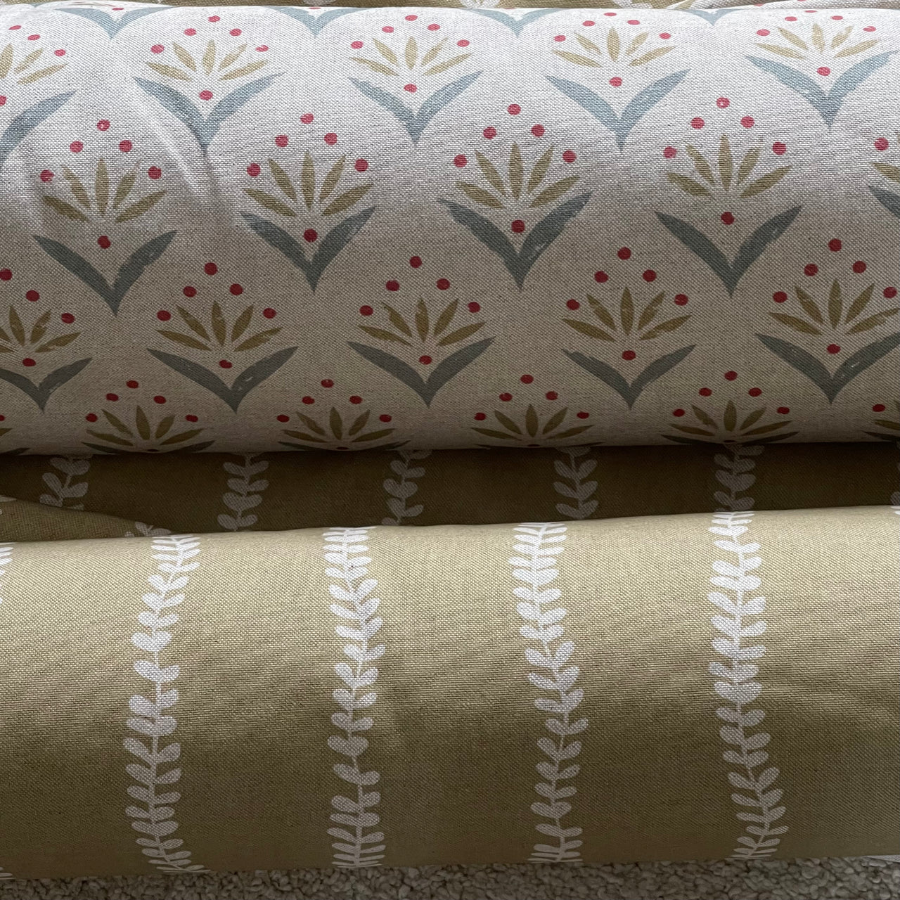Three fabric swatches with different patterns stacked on top of each other.