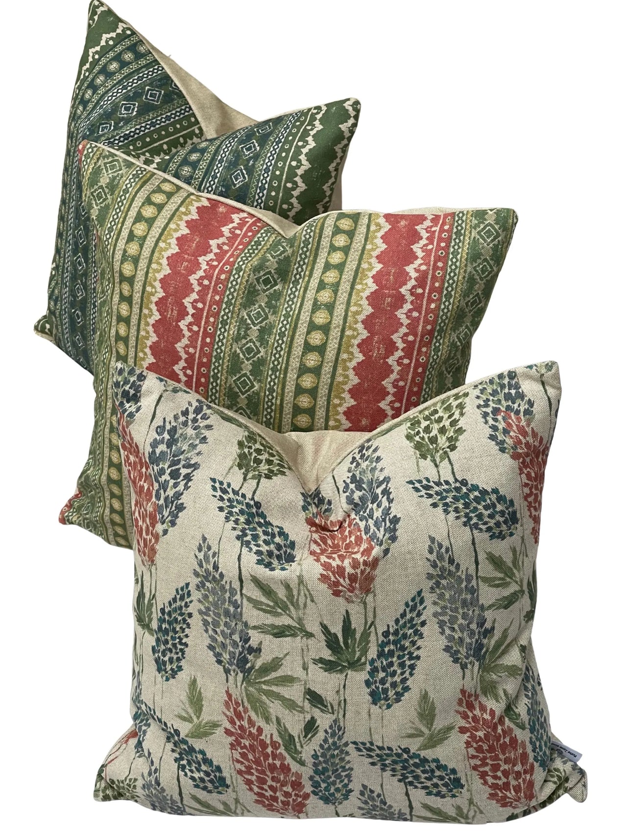 Group of three cushions: clover print plus two striped designs in matching tones.