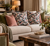 Thumbnail for Blush pink crane and exotic bird cushions arranged on a neutral sofa, creating an elegant botanical living room with navy and soft pink accents.