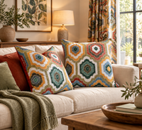 Thumbnail for Colourful Medina Bloom geometric medallion cushions styled on a neutral sofa in a bohemian living room with natural wood furniture and warm decorative accents.