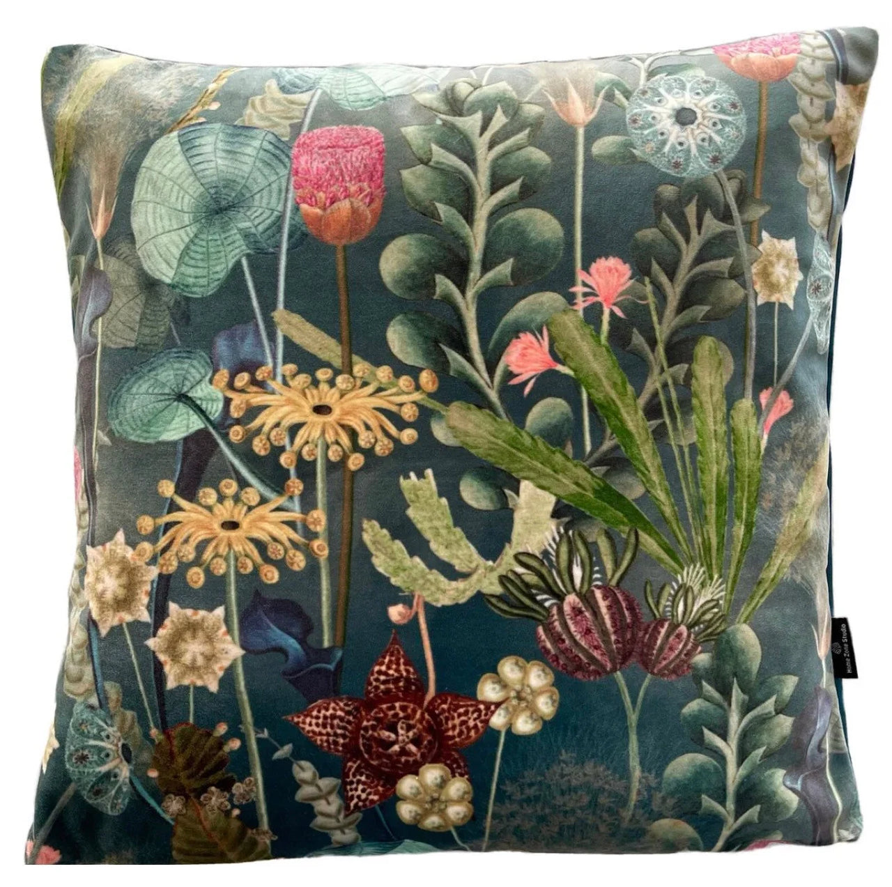 Decorative pillow with floral and botanical design on a dark green background