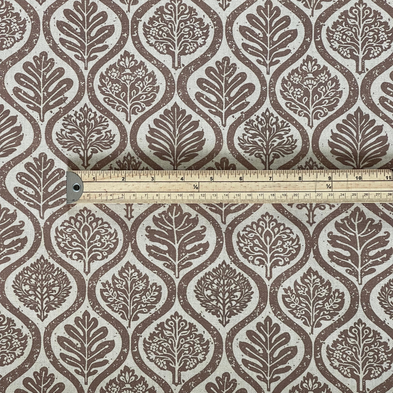 upholstery fabric with taupe botanical print and ogee pattern