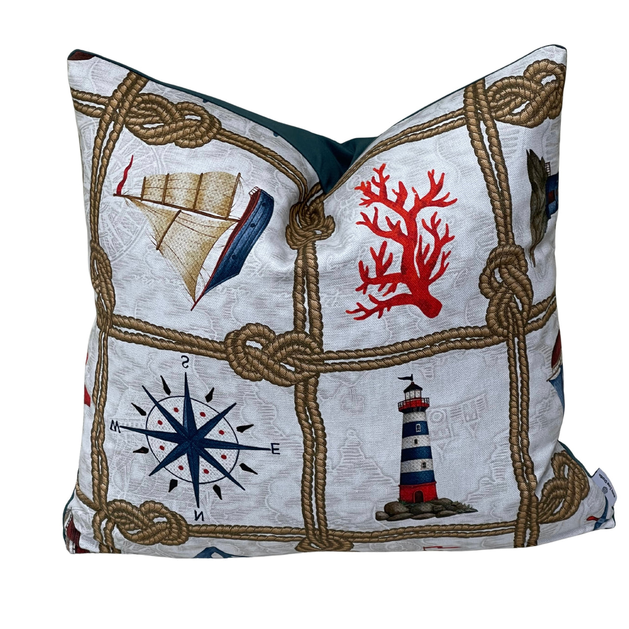 Handmade nautical coastal cushion cover featuring vintage sailing boats, navy compass roses, red lifebuoys and decorative rope knots on natural cotton fabric, perfect for beach house and seaside cottage décor.