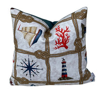 Thumbnail for Handmade nautical coastal cushion cover featuring vintage sailing boats, navy compass roses, red lifebuoys and decorative rope knots on natural cotton fabric, perfect for beach house and seaside cottage décor.