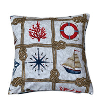 Thumbnail for Handmade nautical cushion cover featuring rope knots, sailing boat, navy compass, red coral and lifebuoy motifs on natural cotton fabric.
