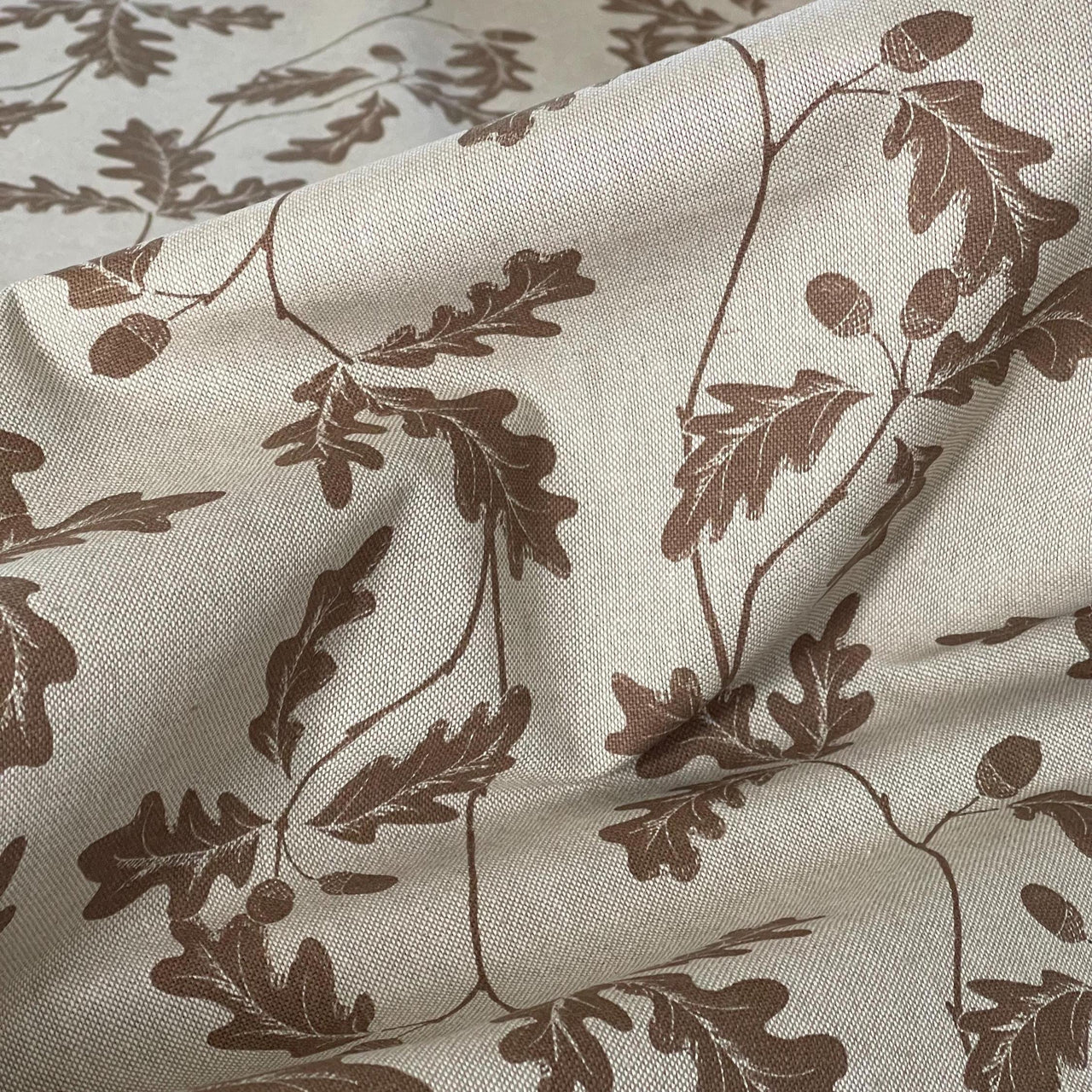 Nature-inspired cotton blend fabric with botanical oak leaf print in earthy brown – ideal for curtains, blinds, and soft furnishings