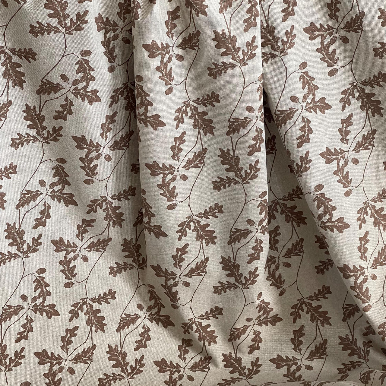 Beige cotton-linen upholstery fabric with botanical oak leaf and acorn pattern – perfect for custom blinds, drapes, and cottage-style interiors