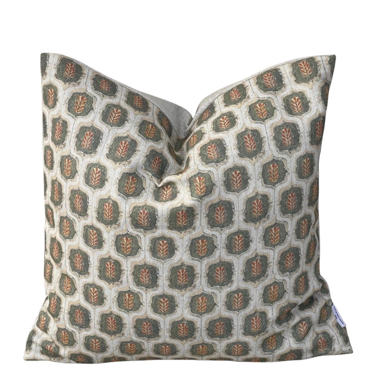 Olive green and rust botanical leaf trellis cushion cover on a natural background