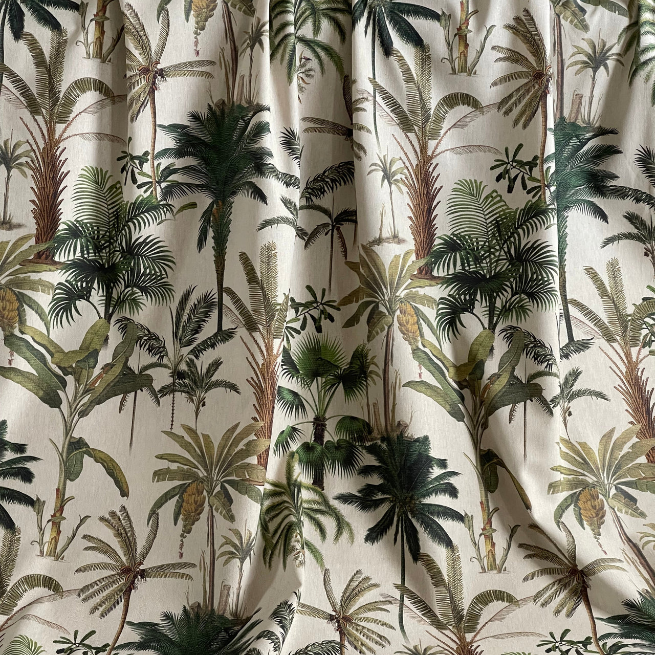 Close-up of fabric with a tropical leaf pattern