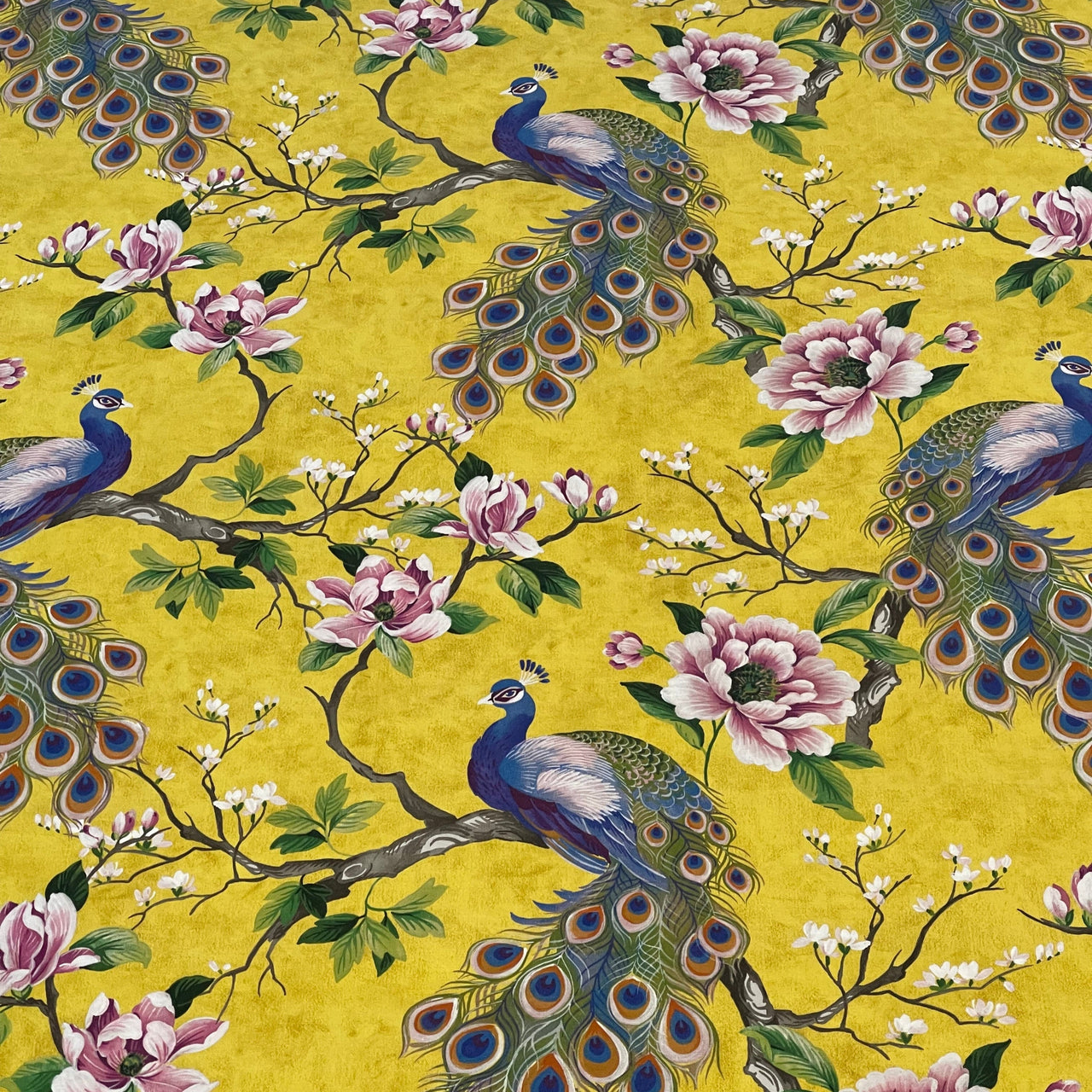 Vibrant peacock feather and magnolia design on cotton fabric